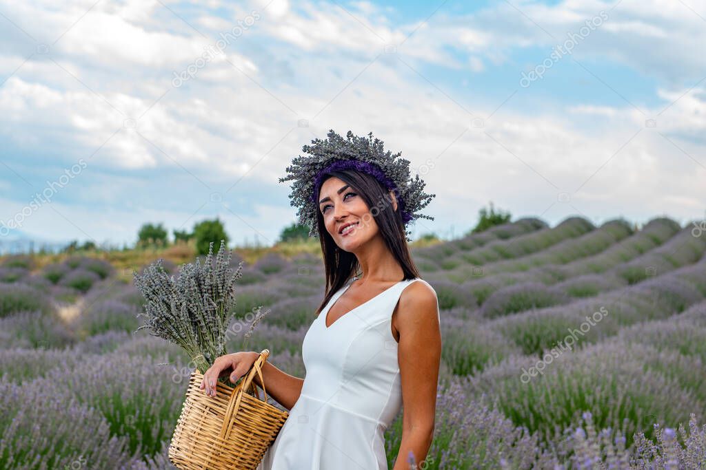 Turkey's lavender paradise: Kuyucak Village, Isparta - Turkey . Beautiful woman in the lavander field of the Kuyucak Isparta. Woman model is walking through lavender fields. 