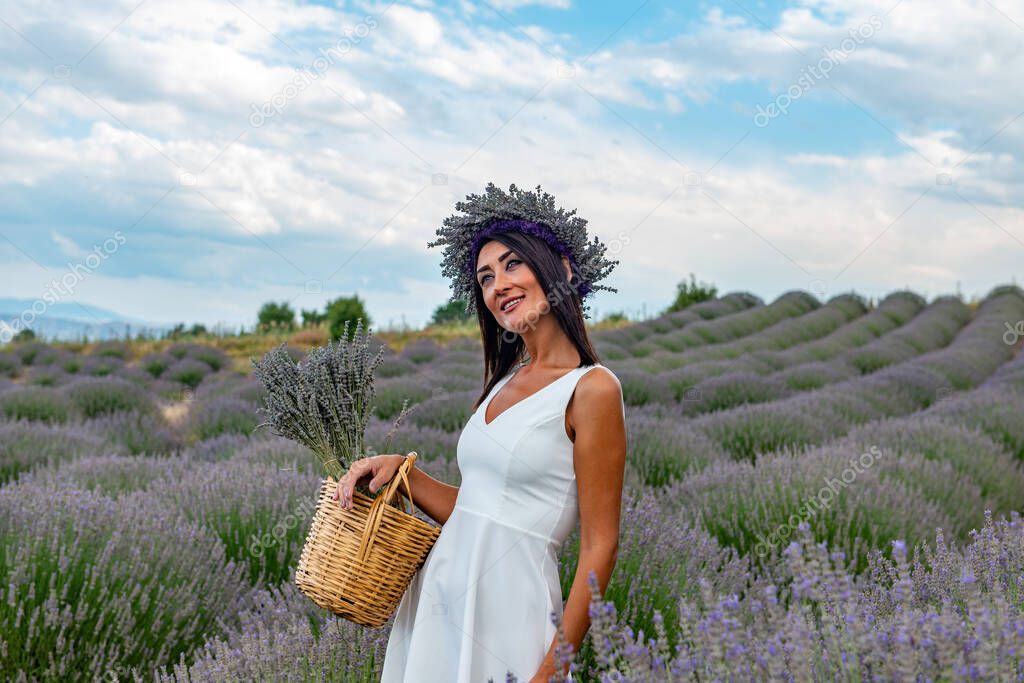 Turkey's lavender paradise: Kuyucak Village, Isparta - Turkey . Beautiful woman in the lavander field of the Kuyucak Isparta. Woman model is walking through lavender fields. 