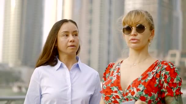 Portrait Of Two Adult Women Walking And Having A Conversation On The City Streets Portrait Of Two Adult Women Walking And Having A Conversation On The City Streets