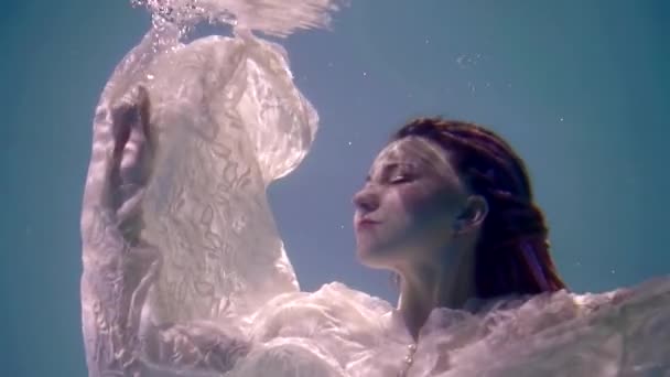 Dramatic Shot Of Sinking Romantic Girl Inside Water Of Lake Face With Ripple Of Sun Rays On Skin