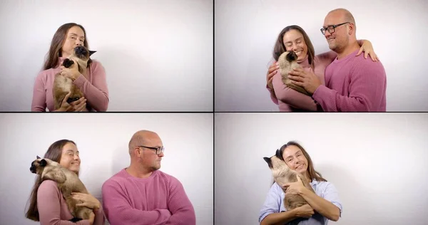 Collage shooting of portraits of a dark-haired woman and a bald man with glasses. Theyre wearing pink sweaters. They hold a Siamese cat in their arms. They stroke her, the Man emotes, improvises.