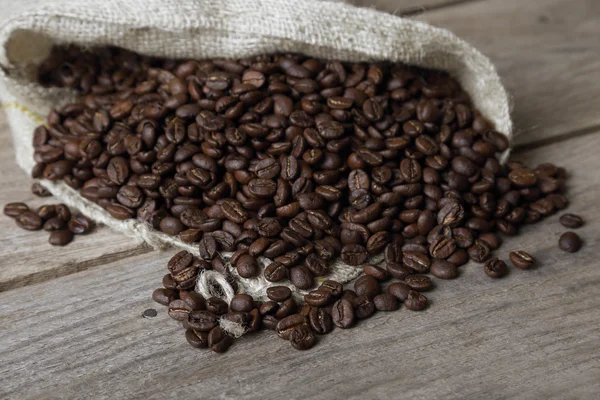 Coffee beans in sackcloth sack — Stock fotografie