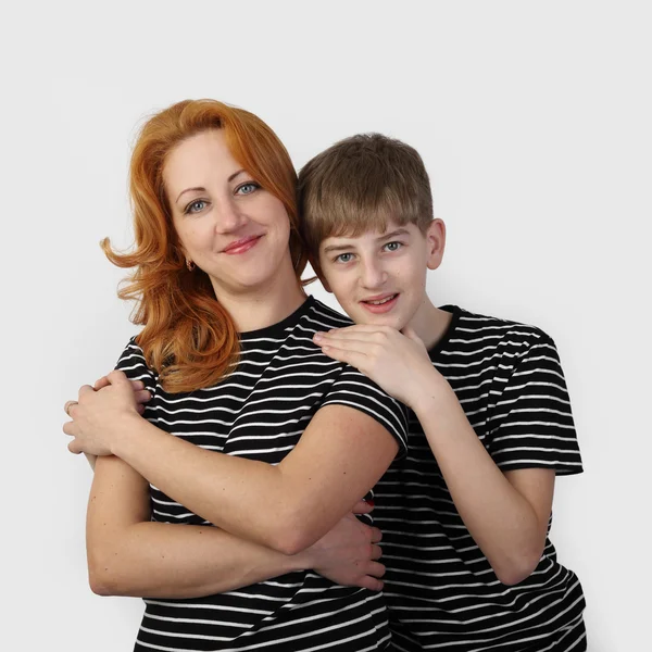 Mother and son on gray — Stock Photo, Image