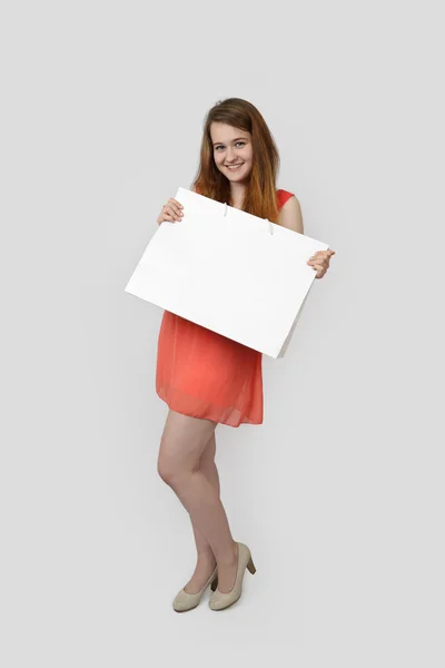 Young girl with bag on gray — Stock Photo, Image