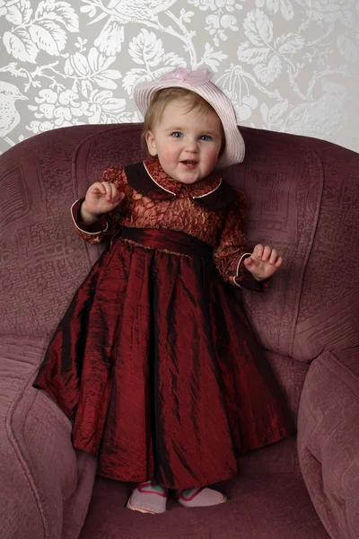 Infant in in long red dress — Φωτογραφία Αρχείου