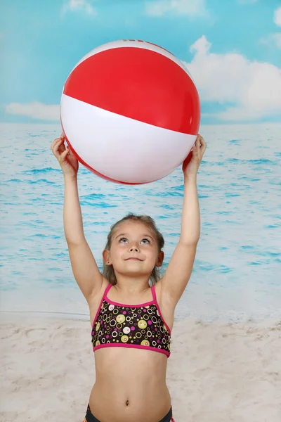 Cute little girl on beach with ball — Φωτογραφία Αρχείου