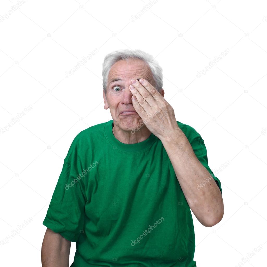 Senior man closed one eye