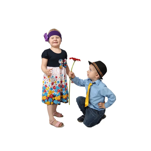 Little boy gifts flower to girl — Stockfoto