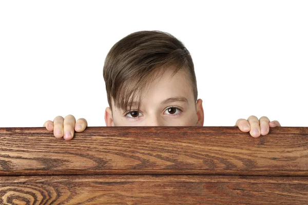 Boy look over fence — Stockfoto