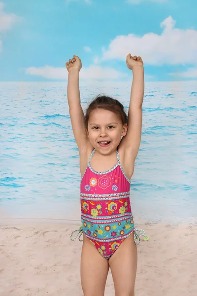 Cute little girl jumps on beach — Φωτογραφία Αρχείου