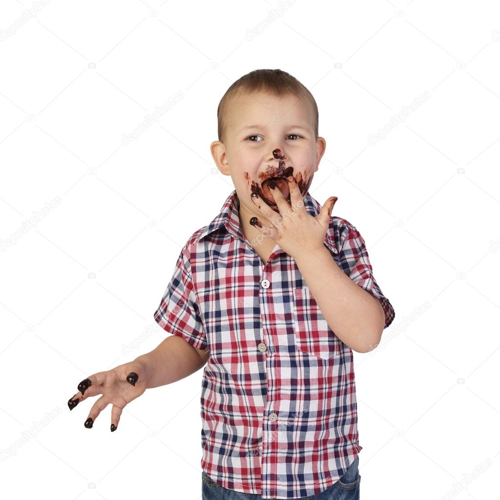 Little boy smeared with chocolate