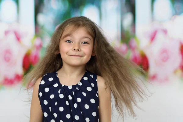 Pretty little girl with long flying hair — Stock Photo, Image