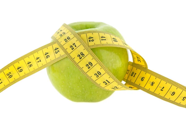 Het concept van dieet. Kleurrijk meetlint op een groene sappige ap — Stockfoto