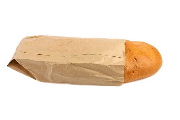 Буханка белого хлеба в сером бумажном пакете, изолированном на белом бэкгро — стоковое фото