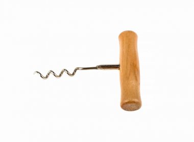 Corkscrew and cork on a white background