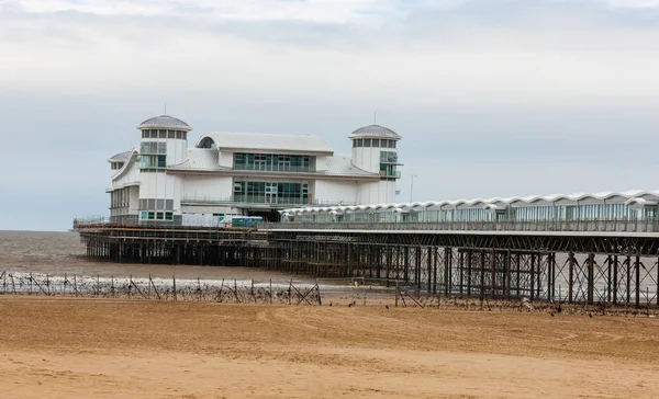 Refurbished Grand Pier at low tide on Weston-Super-Mare beach, Somerset, England