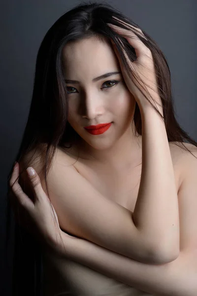 Studio shot of portrait beautiful asian woman with strapless dre — Stock Photo, Image