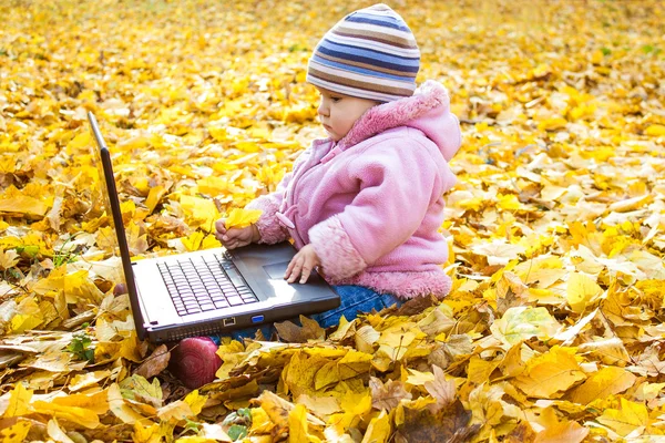 Happy little girl    with laptop — Stock Photo, Image