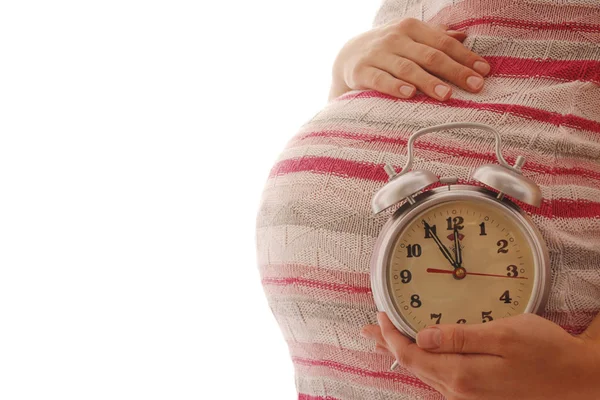 Pregnant woman with alarm clock — Stock Photo, Image