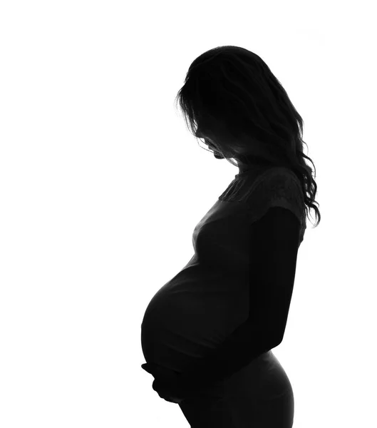 Силуэт беременной женщины — стоковое фото