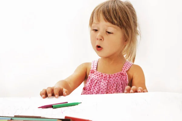 Happy child draws on a white background — Stock Photo, Image