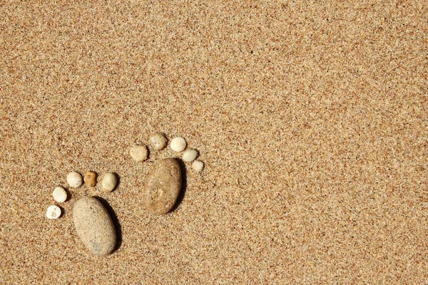 Feet of a family of stones on the sea — Stock Photo, Image