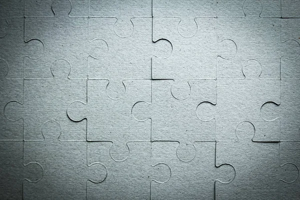 Puzzles on the table background — Stock Photo, Image