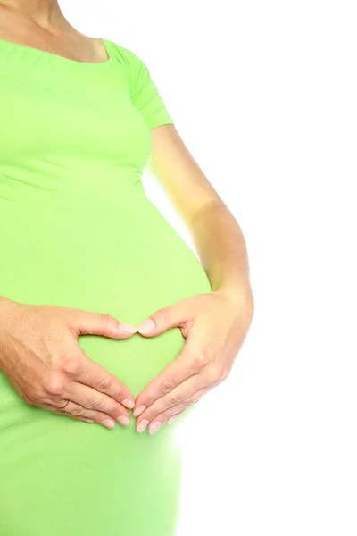 Happy pregnant girl lies on white background — Stock Photo, Image