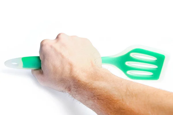 Keukengereedschap in de handen op een witte achtergrond — Stockfoto