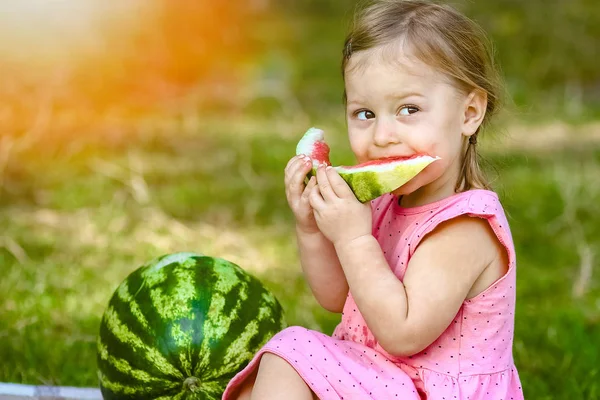 Happy child with watermelon on nature in the park — Stock Photo, Image