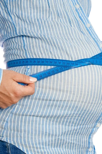 Happy pregnant girl lies on white background — Stock Photo, Image