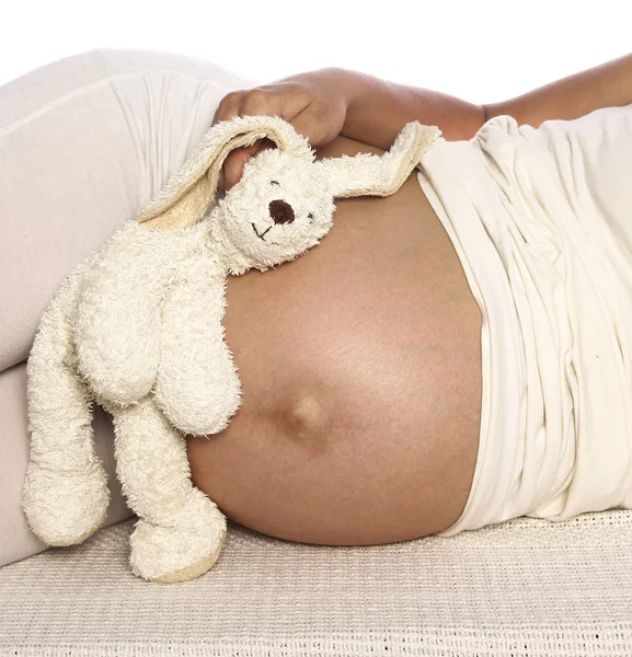 Mulher grávida em um fundo branco — Fotografia de Stock