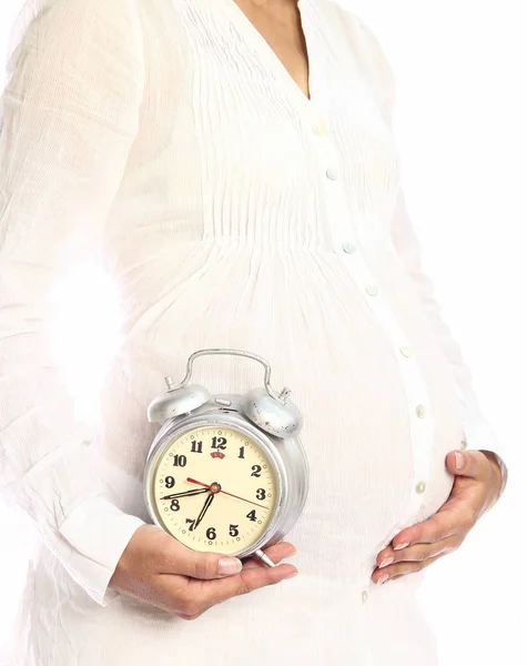 Donna incinta su uno sfondo bianco — Foto Stock