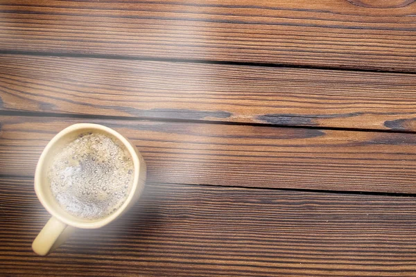 Tasty coffee on a wooden background — Stock Photo, Image