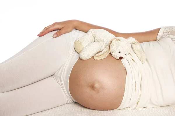 Pregnant woman on a white background — Stock Photo, Image