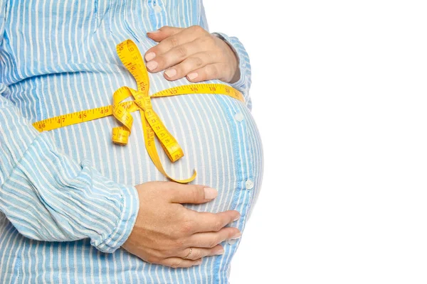 Happy pregnant girl lies on white background — Stock Photo, Image