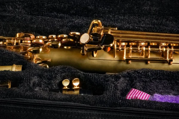 Soprano saxophone in a case on a black background — 스톡 사진