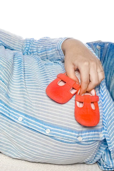 Happy pregnant girl lies on white background — Stock Photo, Image