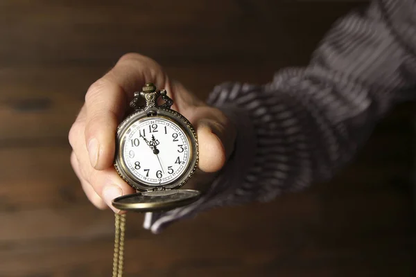 A pocket watch in the hands of a man — Stock Photo, Image