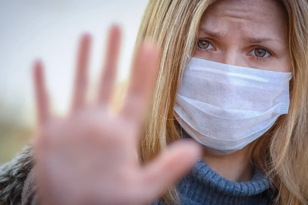 masked woman against kronavirus contaminated air protection