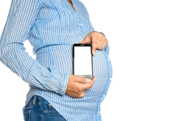 Chica Embarazada Feliz Con Teléfono Sus Manos Sobre Fondo Blanco —  Fotos de Stock