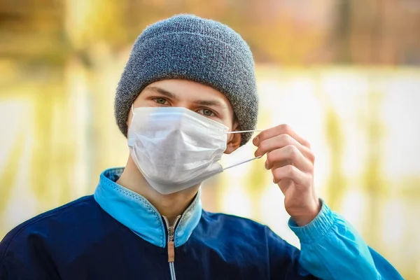 masked man from coronavirus and air. Protection against PM 2.5 air polluted from the virus in Europe and Asia