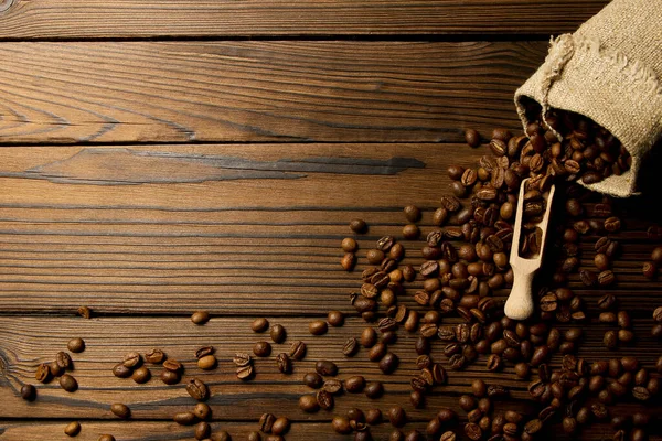 Una Bolsa Café Sobre Fondo Madera —  Fotos de Stock