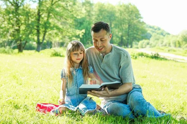 Young Father Happy Daughter Reading Bible Nature — Stock Photo, Image