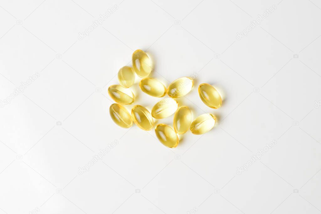 Fish oil pills on a white background. Copy space.