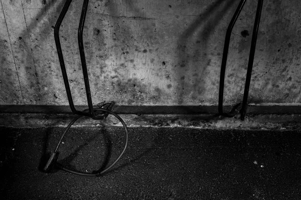 lonely bike lock in a bicycle rack