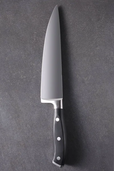 cook knife on a slate board