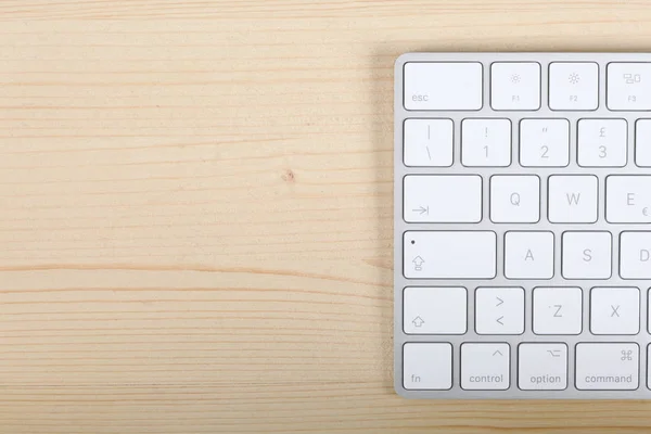 home banking password generator on a wooden desk, a computer keyboard with copy space for your text