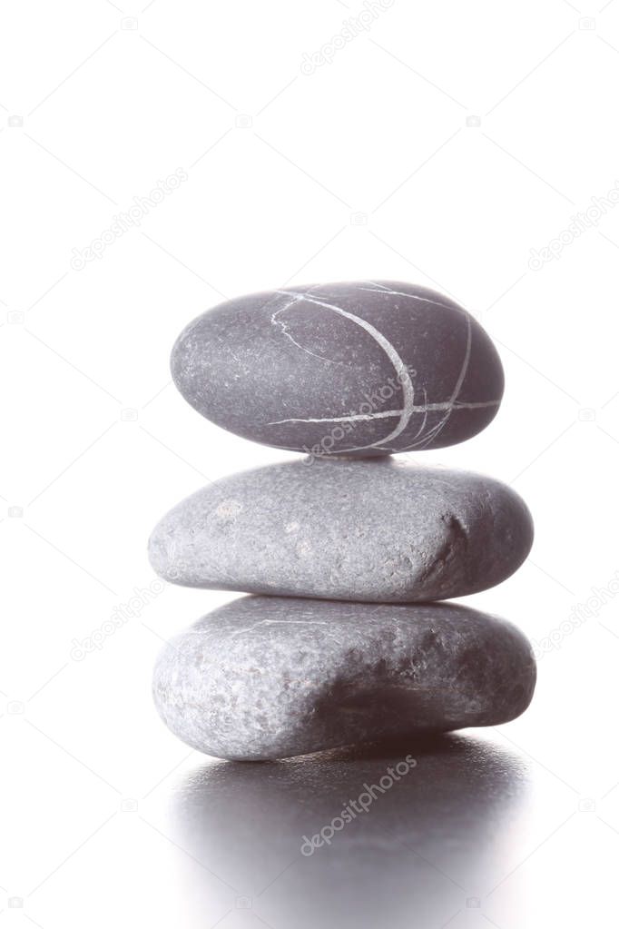 stack of zen stones concept piled up on white background