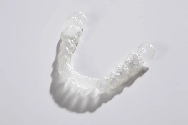 transparent teeth brace aligenr isolated on white background with copy space for your space